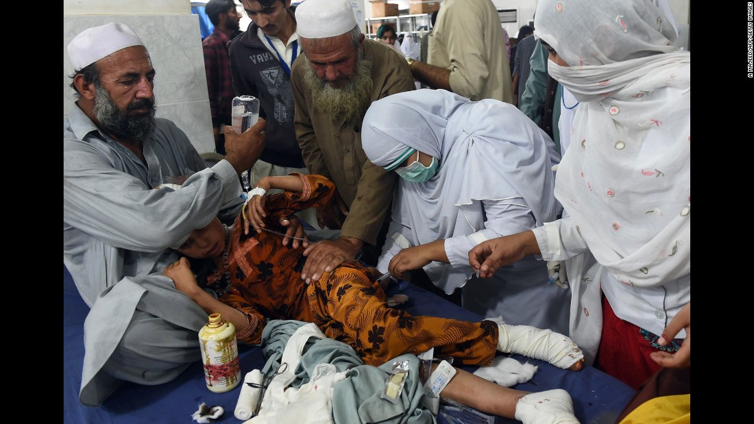 Paramedics treat an injured girl at a hospital in Peshawar.