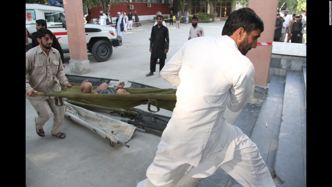 People transfer an injured child to a hospital in Jalalabad, Afghanistan.