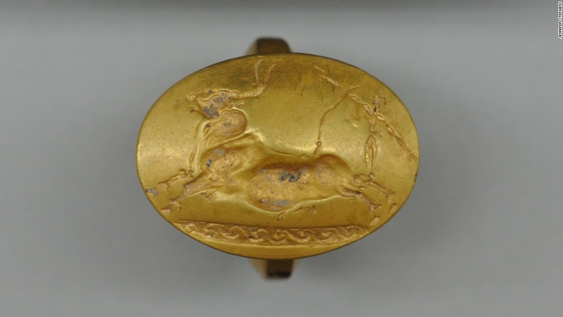 Four solid-gold rings were found in the tomb -- more than have been found at any single burial site elsewhere in Greece, according to the archaeologists. This one depicts a Cretan bull running scene.