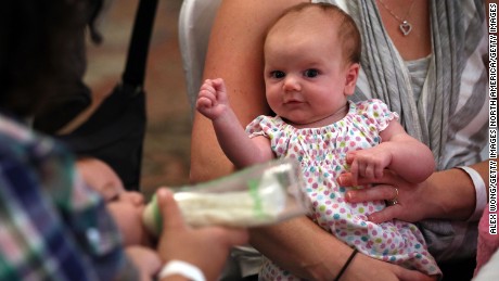 SPRINGFIELD, VA - AUGUST 21:  Eight-week-old Eleanor Delp attends a &quot;What to Expect&quot; baby shower with her mother August 21, 2012 in Springfield, Virginia. The DC Metro Chapter of Operation Homefront held the event, with parenting and pregnancy workshops, to celebrate with 100 new and expecting military mothers representing each branch of service from DC, Maryland and Northern Virginia.  (Photo by Alex Wong/Getty Images)