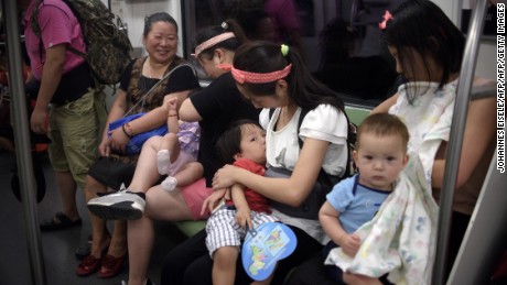 Mothers breastfeed their babies in a subway during an event of the world breastfeeding week on August 1, 2015.  Around 20 mothers breastfed their babies in a subway to promote the support of women to combine breastfeeding and work.   AFP PHOTO / JOHANNES EISELE        (Photo credit should read JOHANNES EISELE/AFP/Getty Images)