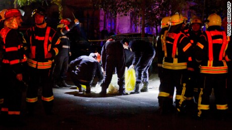 Forensic workers collect items outside the site of an explosion that occurred  in a club in Bucharest, early Saturday, Oct. 31, 2015. An explosion and ensuing flames on a stage at a Bucharest nightclub on Friday left more than 20 people dead and over 100 hospitalized with injuries, Romania&#39;s interior minister said. (AP Photo/Vadim Ghirda)