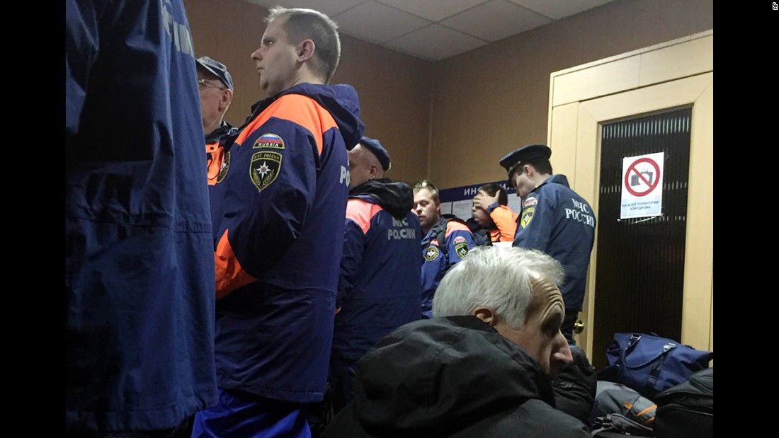 Employees with the Russian Ministry for Emergency Situations wait in Moscow for their flight to Egypt on October 31.