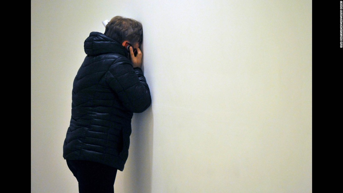 A relative reacts to news at Pulkovo International Airport on October 31.