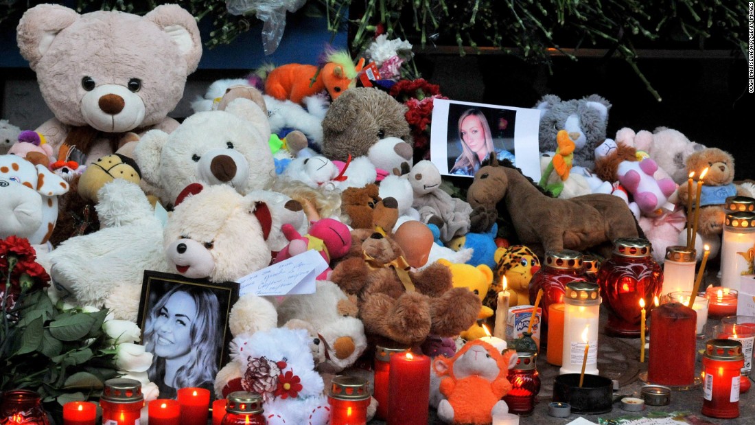 Candles, toys, flowers and portraits are left at Pulkovo International Airport outside St. Petersburg on November 1.