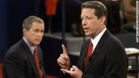 ST. LOUIS:  Democratic presidential nominee Al Gore answers a question as Republican presidential nominee George W. Bush listens during their third debate at Washington University on October 17, 2000. 