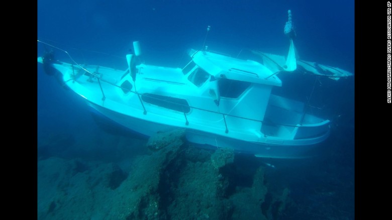 The Kusadasi Ilgun, a sunken 20-foot boat, lies in waters off the Greek island of Samos in November 2016. 