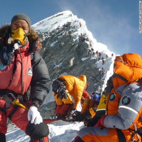 Nepalese mountaineer Pemba Dorje Sherpa (L) and others pause at the Hillary Step while pushing for the summit of Everest on May 19, 2009. from the south face of Nepal.    Bad weather conditions forced three Nepalese Sherpa brothers to give up their plans to set a new world record by spending 24 hours in the &quot;death zone&quot; on top of Mount Everest. Pemba Dorje Sherpa, 30, and his two younger brothers reached the summit on May 19, but were forced down after only two hours, Pemba told AFP after returning to Kathmandu.      AFP PHOTO/COURTESY OF PEMBA DORJE SHERPA (Photo credit should read STR/AFP/Getty Images)