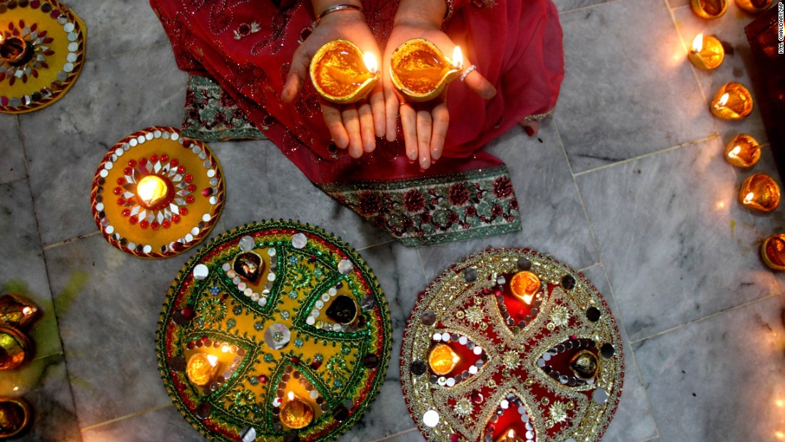 A Hindu woman lights candles during Diwali celebrations at a temple in Lahore, Pakistan, on November 11. 