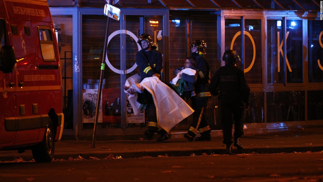 Wounded people are evacuated outside the Bataclan concert hall.
