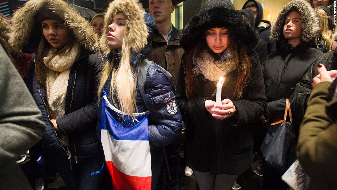 People attend a vigil outside the French Consulate in Montreal. Prime Minister Justin Trudeau offered &quot;all of Canada&#39;s support&quot; to France on Friday, November 13, in the wake of the attacks.