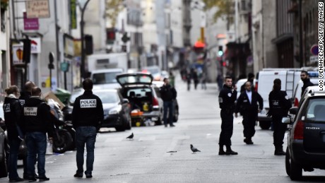 Police are seen near the Cafe La Belle Equipe at the Rue de Charonne in Paris on November 14, 2015, following a series of coordinated attacks in and around Paris late Friday which left more than 120 people dead.  AFP PHOTO / LOIC VENANCE        (Photo credit should read LOIC VENANCE/AFP/Getty Images)