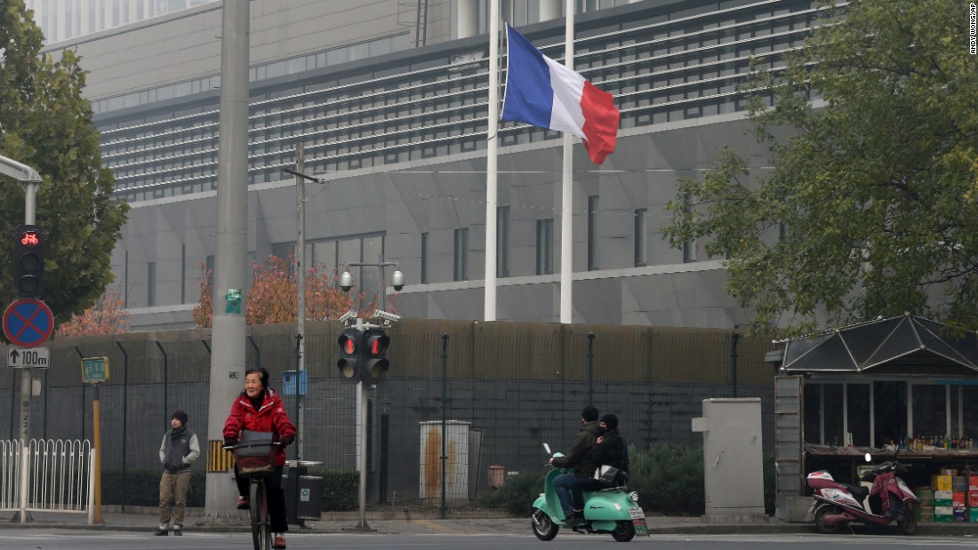 The French national flag flutters at half-staff on November 14 at its embassy in Beijing.