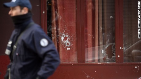 Bullet holes are seen on the windows of Le Carillon bar, the day after a deadly attack on November 14 in Paris, France. 