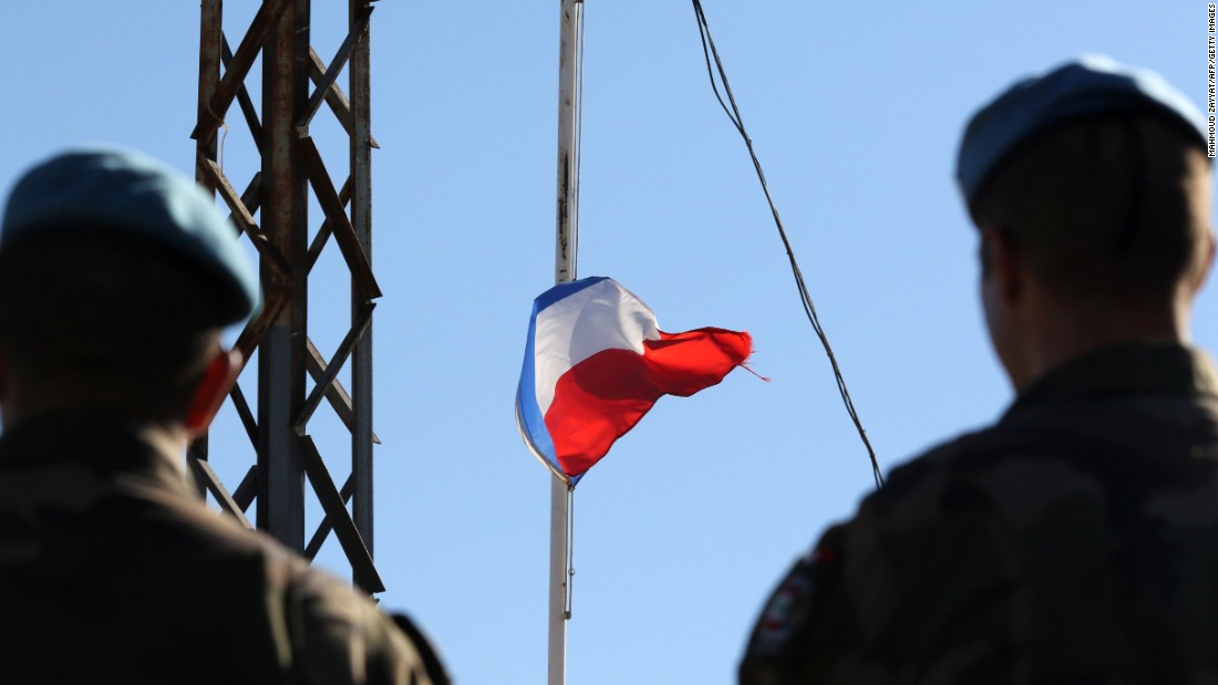 French soldiers of the United Nations&#39; interim forces in Lebanon observe the national flag at half-staff at the contingent headquarters in the village of Deir Kifa on November 14.