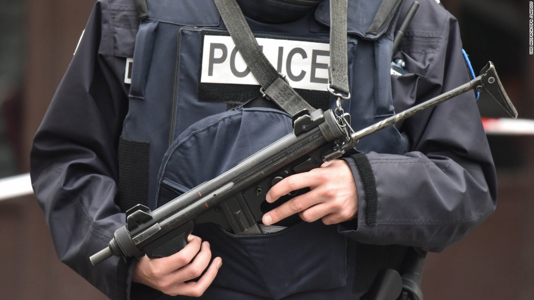 A police officer stands guard outside the Cafe Bonne Biere in the Rue de la Fontaine au Roi in Paris on November 14. 