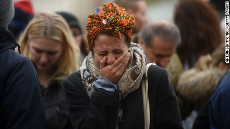 A woman weeps in Paris on November 14, the day after a series of deadly attacks in the French capital. 