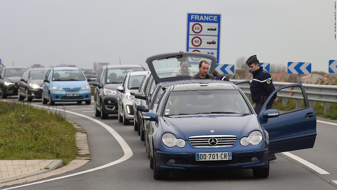 Security personnel inspect vehicles at the border between Belgium and France on Saturday, November 14.