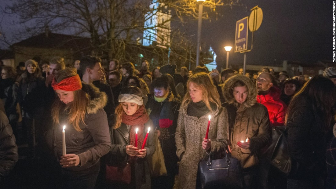 Lithuanians hold a candlelight vigil in front of the French Embassy in Vilnius, Lithuania, on November 14.