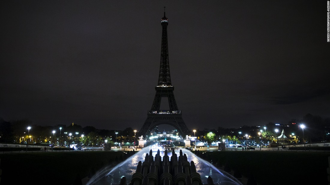 The Eiffel Tower stands dark as a mourning gesture on November 14, in Paris. More than 125 people were killed in a series of coordinated attacks in Paris on Friday. People around the world reacted in horror to the deadly terrorist assaults.