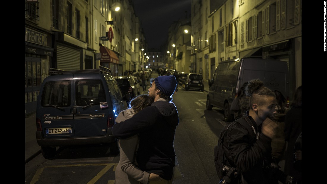 A couple embraces in the streets of Paris on November 14. The world has rallied around France.