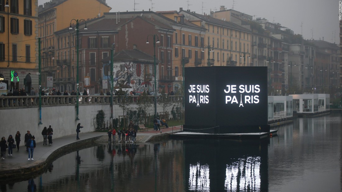 An electronic billboard on a canal in Milan, Italy reads, in French, &quot;I&#39;m Paris,&quot; on November 14.