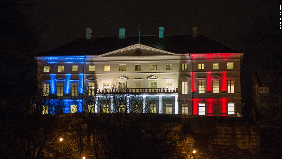 Estonia&#39;s government building in Tallinn glows with the French national colors on November 14.