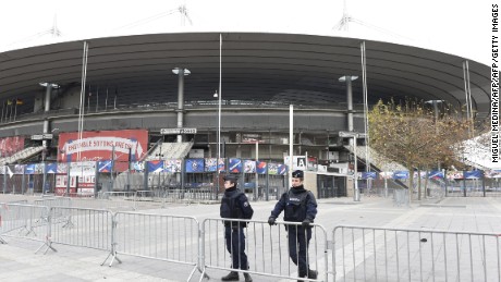 Police secure the area outside the Stade de France stadium, on the outskirts of Paris, on November 14, 2015. Three loud explosions were heard outside France&#39;s national stadium during the first half of a friendly international football match between France and Germany. At least four people died outside the glittering venue which staged the 1998 World Cup final with several others seriously hurt. Some128 people were killed in the Paris attacks on November 13 evening, with 180 people injured, 80 of them seriously, police sources told AFP. AFP PHOTO / MIGUEL MEDINA        (Photo credit should read MIGUEL MEDINA/AFP/Getty Images)