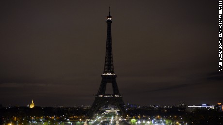 A picture taken on November 14, 2015 shows the Eiffel Tower with its lights turned off following the deadly attacks in Paris.
