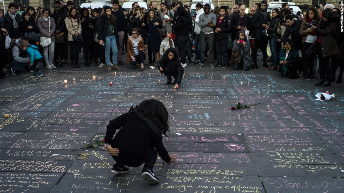 People write messages on the ground at Place de la Republique in Paris on November 15. 