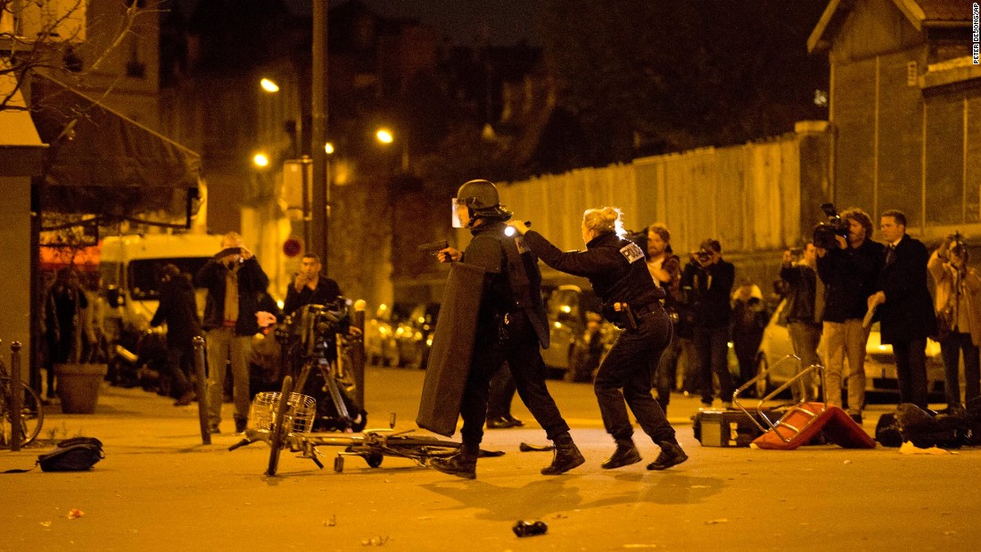 French police secure the perimeter after panic broke out among mourners who paid their respects at the attack sites at restaurant Le Petit Cambodge and the Carillon Hotel in Paris on November 15. 