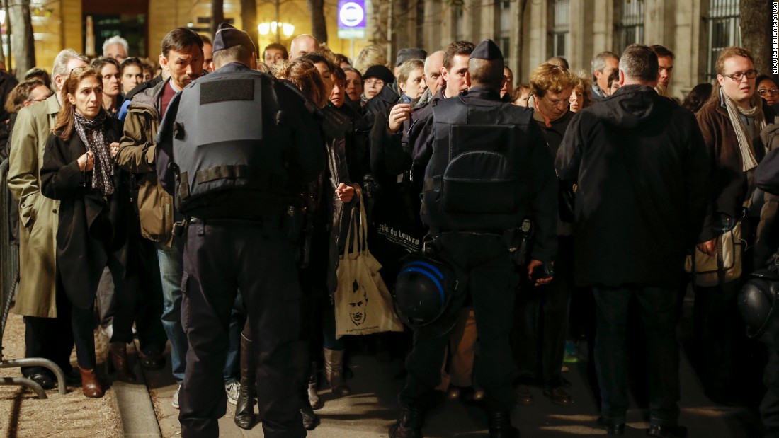 People go through a security checkpoint to attend a Mass in homage to victims of the Paris terror attacks at Notre Dame cathedral in Paris on Sunday, November 15. French President Francois Hollande declared a state of emergency after the attacks in Paris on Friday, November 13, and said border security has been ramped up. The terrorist group ISIS claimed responsibility for the attacks. 