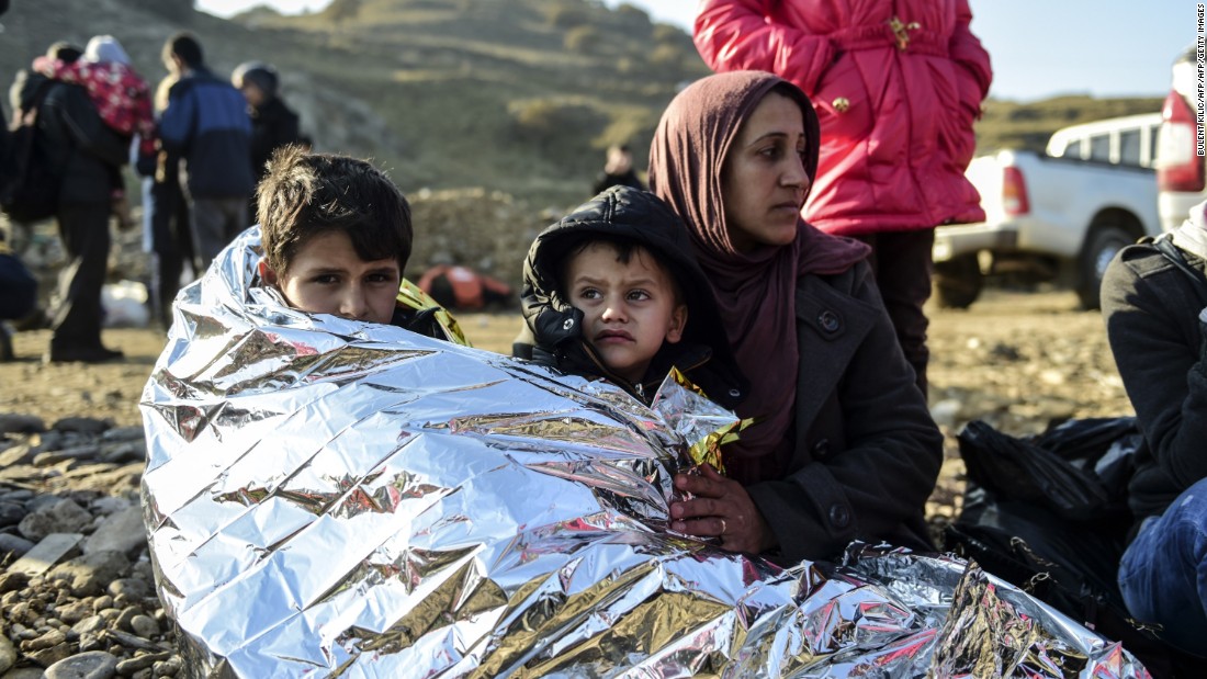 A Syrian family waits after arriving on the Greek island of Lesbos along with other migrants and refugees, on November 17, 2015. Ten of the 11 countries most affected by terrorism also have the highest rates of refugees.  