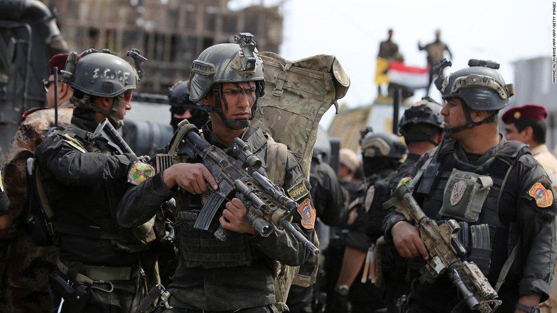 Iraqi counter-terrorism forces patrol a street in Tikrit in April 2015, a day after the country&#39;s prime minister declared victory in the battle to retake the city from ISIS. 