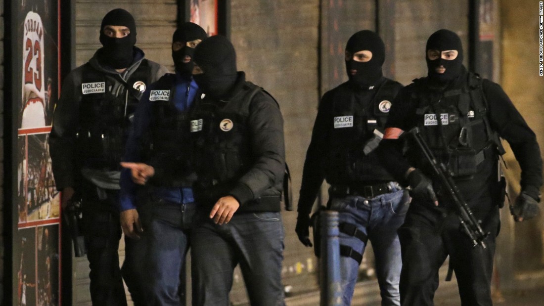 Members of the French police take up position.