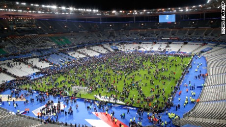 Spectators invade the Stade de France field after the match.