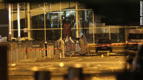 Police work outside the Stade de France after the explosions.