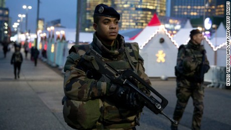 French soldiers patrol at Paris La Defense business district on November 24, 2015 as part of security measures set following November 13 Paris&#39; terror attacks. AFP PHOTO / KENZO TRIBOUILLARD / AFP / KENZO TRIBOUILLARD        (Photo credit should read KENZO TRIBOUILLARD/AFP/Getty Images)