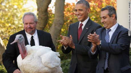 U.S. President Barack Obama &quot;pardons&quot; Abe, a 42-pound male turkey during a ceremony with Jihad Douglas (R), chairman of the National Turkey Federation, in the Rose Garden at the White House  November 25, 2015 in Washington, DC. 