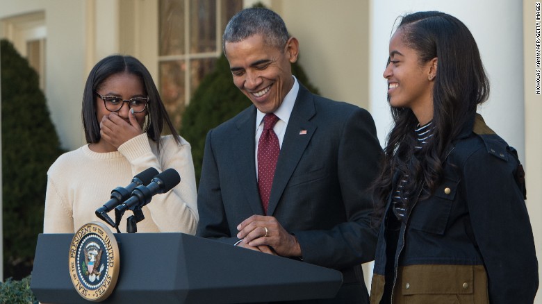 Making a few jokes, President Barack Obama laughs with his daughters, Malia and Sasha, before &quot;pardoning&quot; Abe, the National Thanksgiving Turkey, in the Rose Garden at the White House in Washington, D.C., on November 25, 2015. 