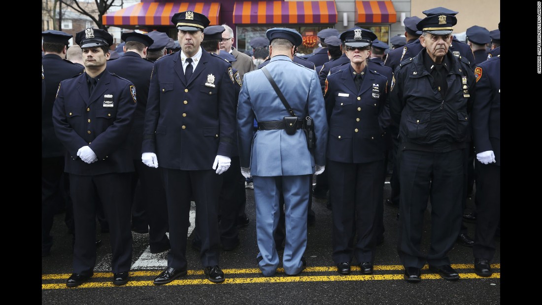 &lt;strong&gt;January 4: &lt;/strong&gt;Law enforcement officers stand outside &lt;a href=&quot;http://www.cnn.com/2015/01/04/us/gallery/liu-funeral/index.html&quot; target=&quot;_blank&quot;&gt;the funeral of fallen New York police officer Wenjian Liu.&lt;/a&gt; Some officers turned their backs while New York Mayor Bill de Blasio spoke on a monitor. &lt;a href=&quot;http://www.cnn.com/2014/12/22/politics/de-blasio-police-shooting/index.html&quot; target=&quot;_blank&quot;&gt;The mayor&#39;s critics&lt;/a&gt; believed his comments after the death of Eric Garner contributed to an anti-police sentiment that led to the shootings of Liu and his partner, Rafael Ramos.