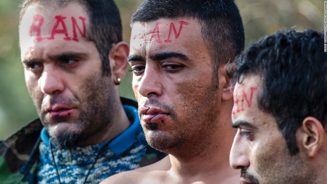 The &#39;Iranian&#39; men are protesting the Macedonian government&#39;s decision to only allow Syrians, Iraqis and Afghans -- those fleeing war - to pass across the border.