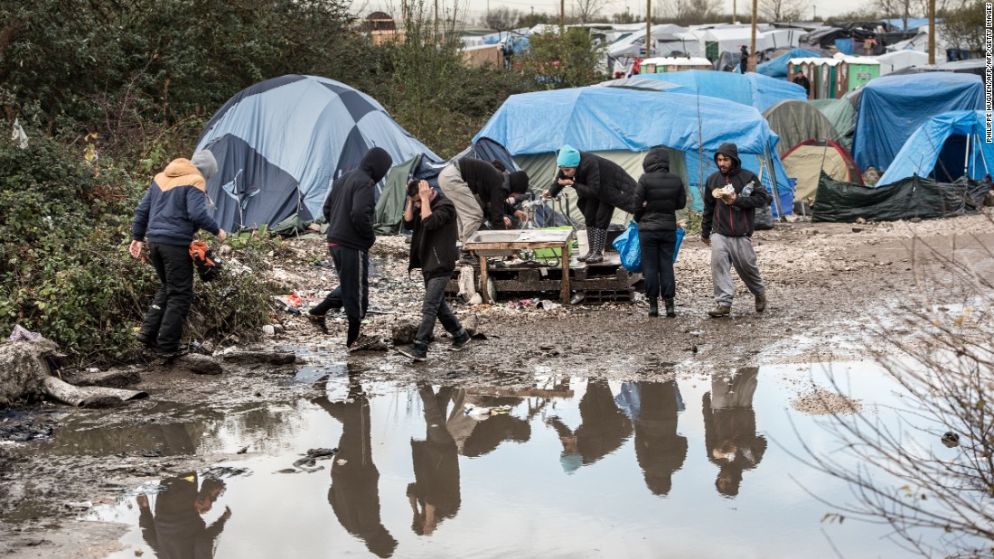 Migrants and refugees in the migrant camp known as the &quot;Jungle&quot; near the northern French port of Calais where some 4,500 people live. 