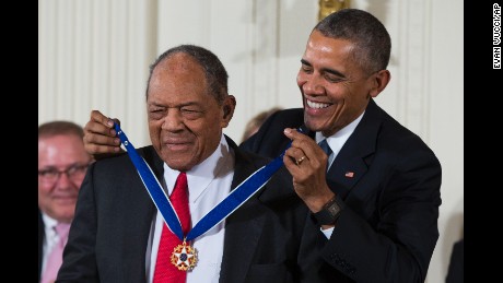 Baseball Hall of Famer Willie Mays, left, receives the Presidential Medal of Freedom from President Barack Obama during a ceremony in the East Room of the White House, on Tuesday, Nov. 24, 2015, in Washington. 