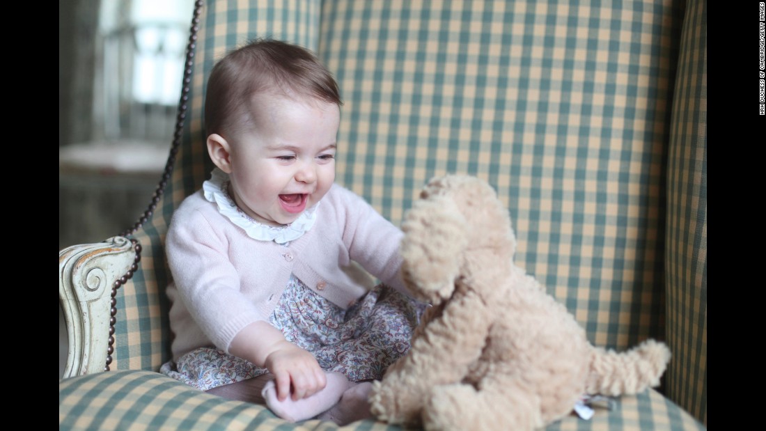 Princess Charlotte plays with a stuffed dog in this photo taken by her mother in November 2015.