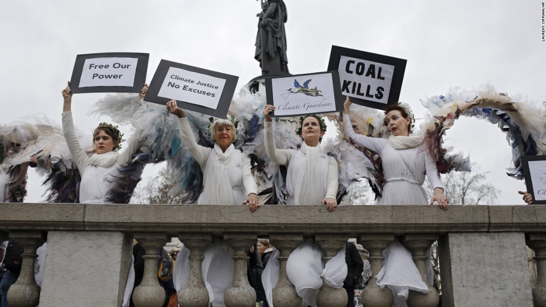 Women dressed as angels pose at the Place de la République.