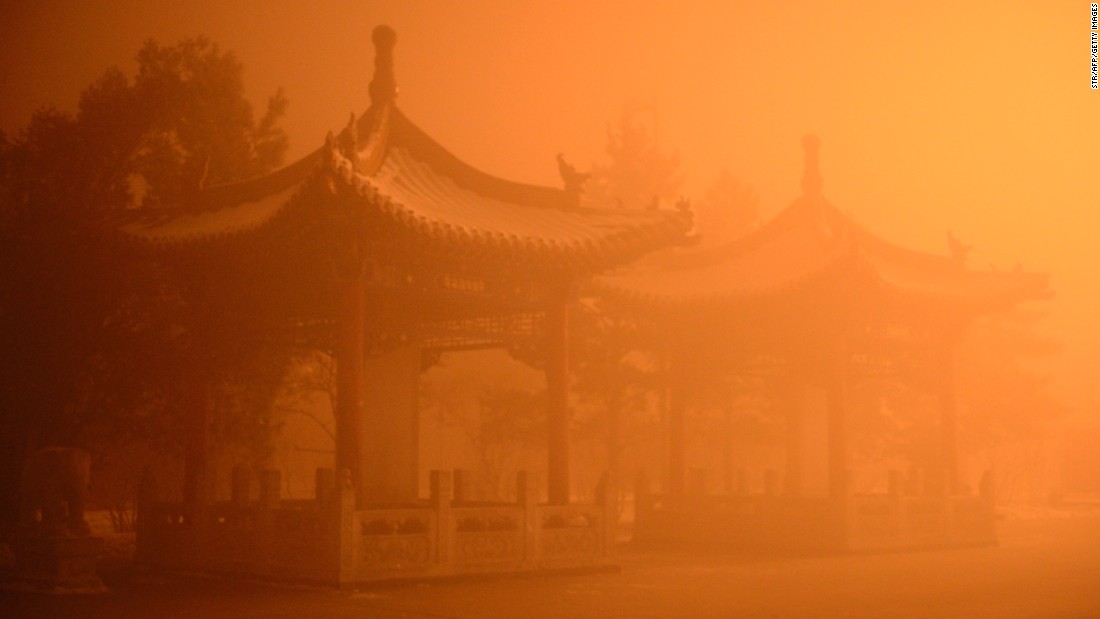 The pollution cast an apocalyptic glow over the pagodas on the streets of Hohhot, Inner Mongolia  on November 29.