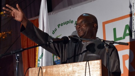 File photo: Roch Marc Christian Kabore waves to supporters in Ouagadougou on December 1, 2015 after winning Burkina Faso&#39;s presidential election.