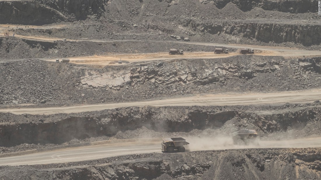 Trucks cross in the main pit of the Jwaneng diamond mine in Botswana, November 2015