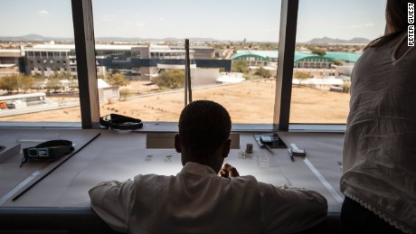 An expert inspects Canadian diamonds at De Beers&#39; Sightholder Sales facility in Gaborone, Botswana